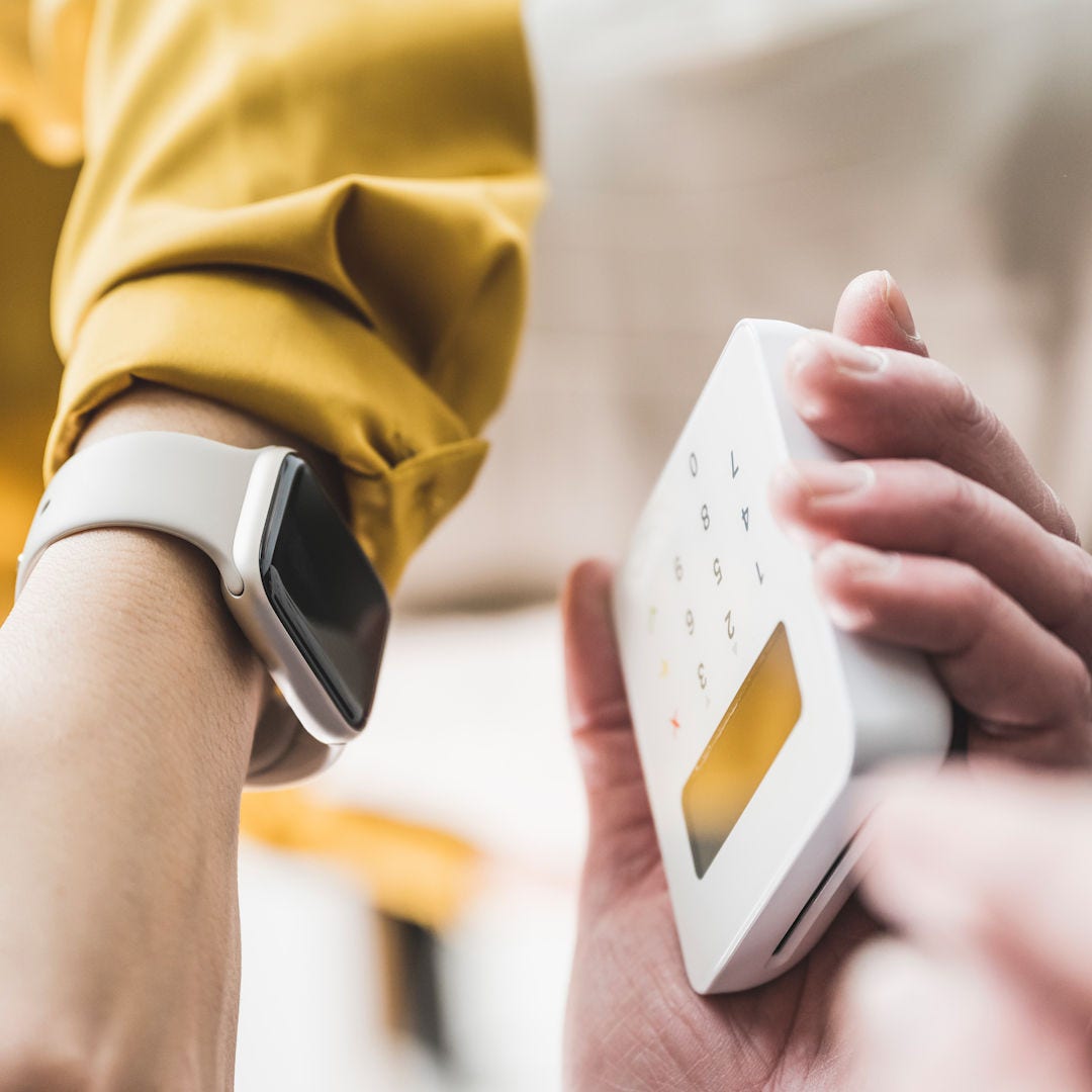 Person making a payment with a watch.